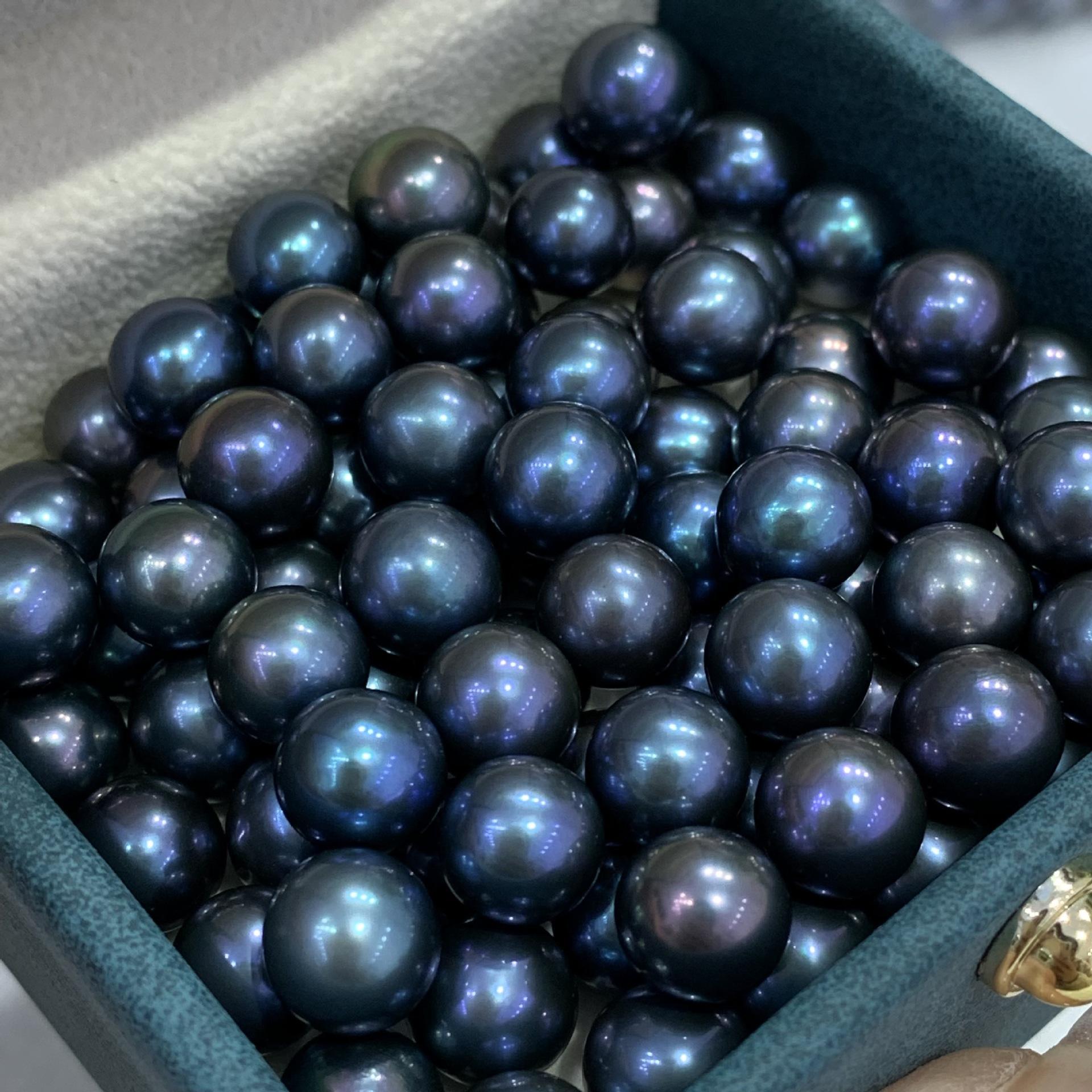 Box filled with dark blue pearls